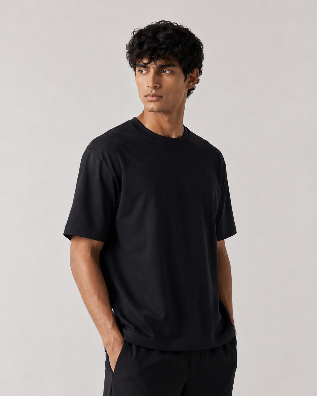 ALTIOR Core Tee in Black — three-quarter view