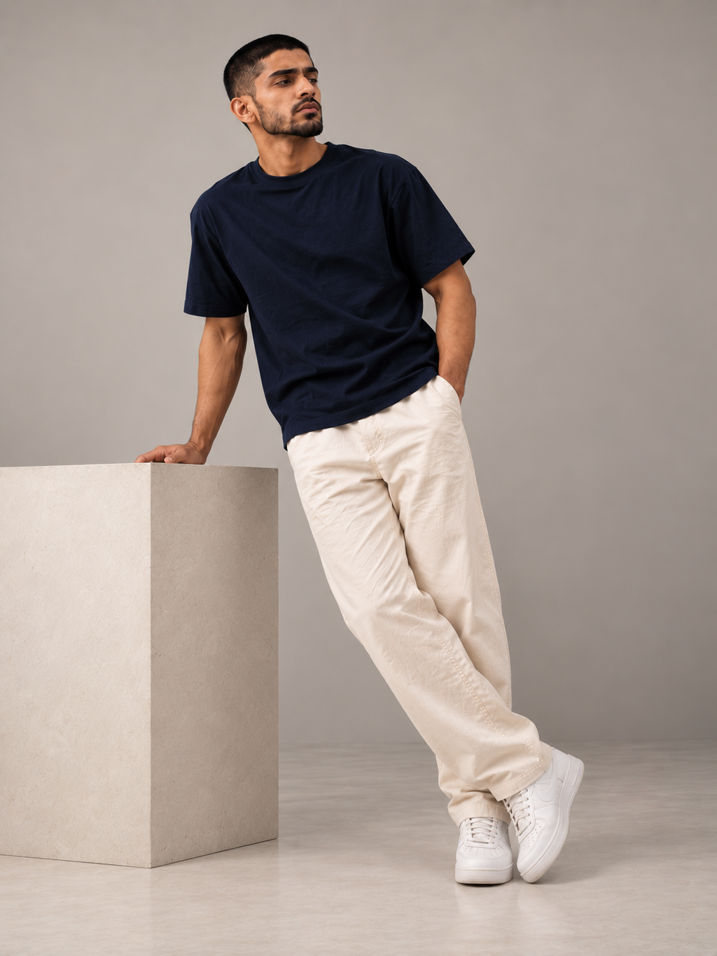 ALTIOR Core Tee in Midnight Navy — three-quarter view, leaning