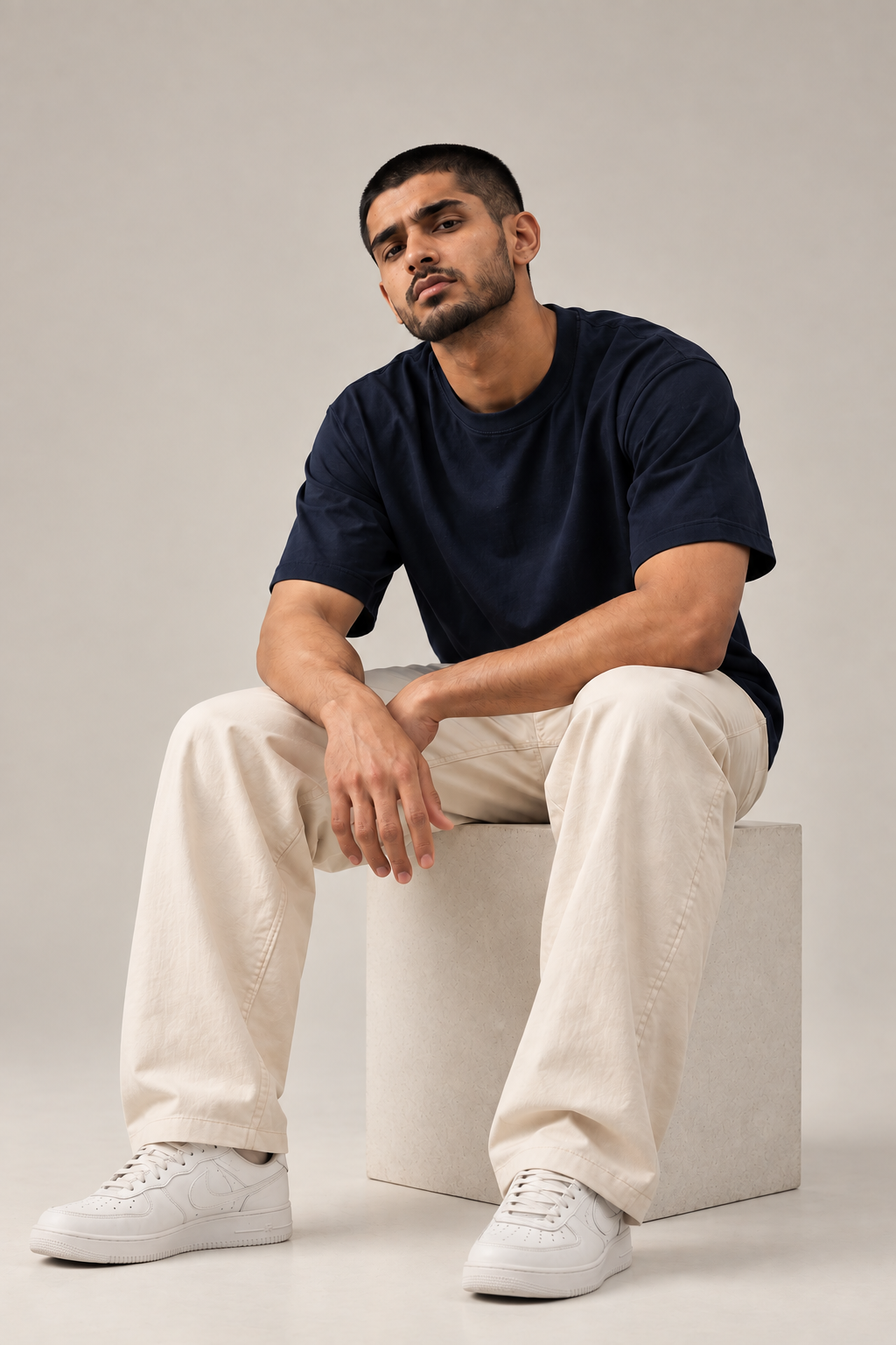 ALTIOR Core Tee in Midnight Navy — seated, front view